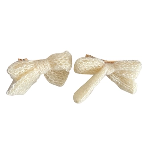 Pair of cream knit bow hair clips with soft fuzzy texture for autumn and winter styling