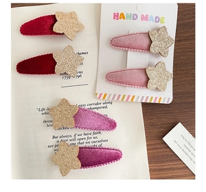 Juego de seis pinzas para el cabello con estrellas de terciopelo rojo y rosa para niñas