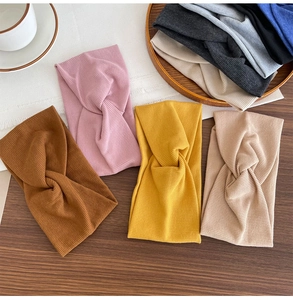 Detail showing the ribbed knit texture and twisted knot design of cotton sports headbands
