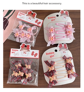 Detailed set of cute cartoon bow hairpins and plush bear hair accessories on card