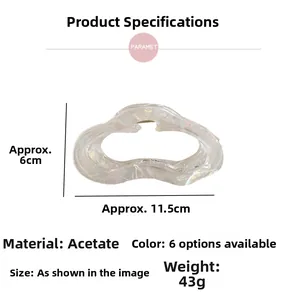 Detail view of large acetate claw clip with iridescent pearl white finish and 11.5cm size