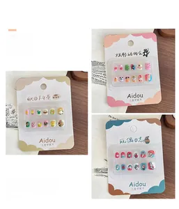 Detailed view of children cartoon press-on nail sets featuring animals and dessert themes