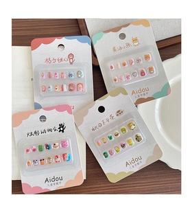 Detail view of 3D cartoon press-on nail kits with cute animal designs for girls