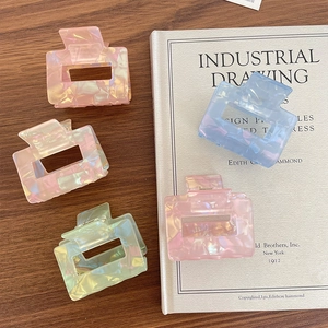 Iridescent square hair claws in pastel pink, champagne, mint, and blue marble finish