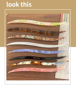 Detail of eight tortoiseshell acetate hair sticks with FRANCE Handmade engraving