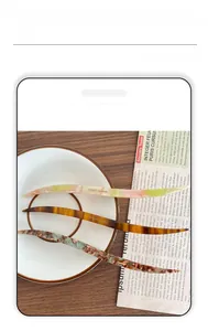 Detail of France handmade hair sticks in marble and tortoiseshell acetate patterns