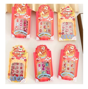Close-up of 6 sets of New Year themed press-on nails for kids with cute cartoon patterns