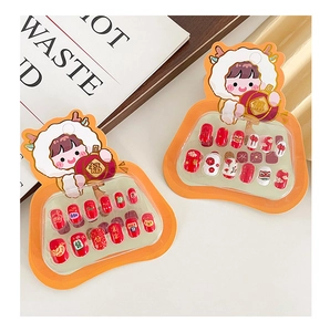 Detailed view of Lunar New Year press-on nails with cartoon lion and lantern designs