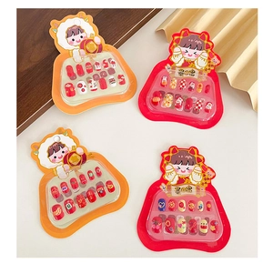 Close-up of colorful cartoon press-on nails set with festive Chinese New Year patterns