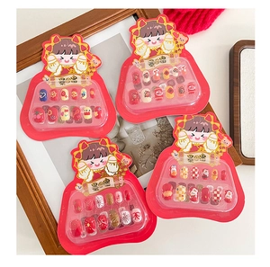 Detail of four sets of festive cartoon press-on nails with shiny glitter and cute patterns