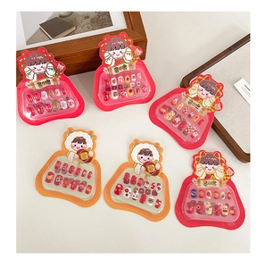 Detailed view of children's New Year press-on nail sets with cartoon lion and flower designs