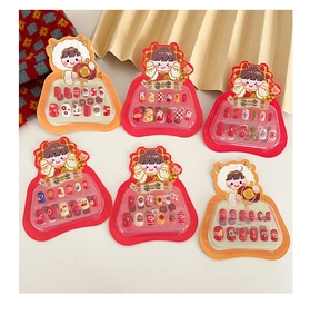 Close-up of colorful cartoon press-on nail sets for children in vibrant festive styles