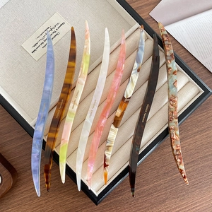 French vintage style acetate hair pins in various colors for elegant bun hairstyles