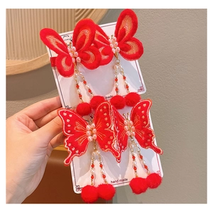 Détails des pinces à cheveux papillon rouge avec broderies et pompons à franges