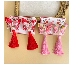 Close-up of Chinese butterfly hair clips with silk tassels and pearls for Hanfu style