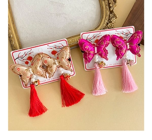 Detailed view of Chinese butterfly hair clips with pearl embroidery and long tassels