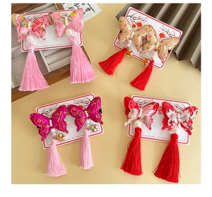 Detail of Chinese style butterfly hair clips with pearl embroidery and long tassels