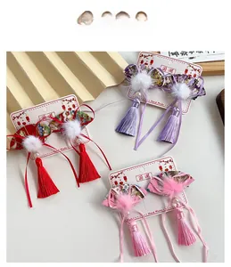 Detail of three pairs of Chinese traditional fan hair clips with tassels and fur balls