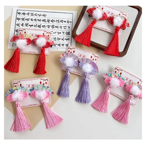Detailed set of traditional Chinese fan hair clips with soft fur balls and long tassels