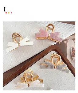 Set mit vier eleganten Schleifen-Haarklammern aus Acetat in Perlmutt, Rosa und Grau