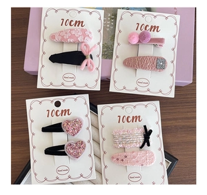Detailed set of handmade 10cm pink fabric hair clips with lace flowers and velvet bows
