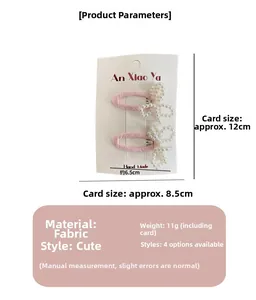 Close-up of pink fabric bow hair clips set with elegant white pearl beads on a card