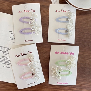 Handmade pearl bow hair clips set in pastel colors with silk texture and metal grip