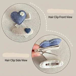 Handmade fabric hair clips set with blue denim heart and cream oval floral patterns