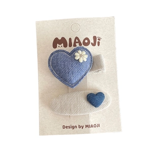Handmade blue fabric hair clip set featuring denim heart and knit flower for girls