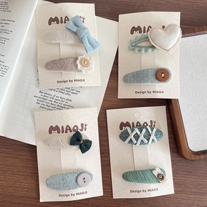 Handmade 4-pair set of embroidered heart and floral hair clips for girls in pastel colors