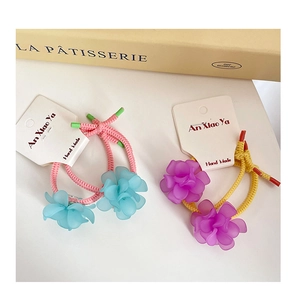 Detailed close-up of handmade elastic flower hair ties with colorful matte resin petals