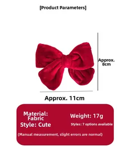 Detailed view showing the red velvet fabric bow hairpin texture and size measurements