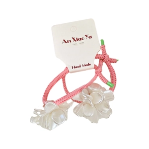 Set of 2 pink braided elastic hair ties with pearlescent white flower resin accents