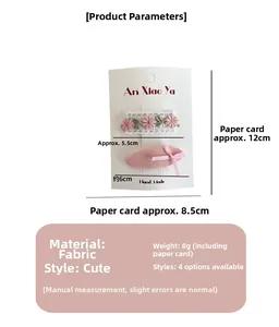 Vue détaillée du lot de barrettes en dentelle florale et nœud rose pour fillettes