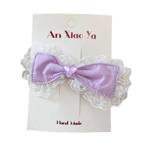 Purple lace bow hair clip with a pink heart crystal ornament for sweet children styles
