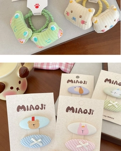 Detail view of cute 3D embroidered bear hair clips and animal pattern hair ties set