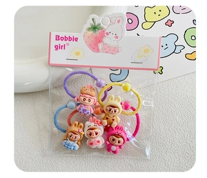 Close-up of set of 5 cute cartoon rabbit and bear elastic hair ties for girls