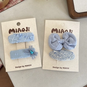 Elegant blue tweed and chiffon bow hair clip set for girls in a gift presentation