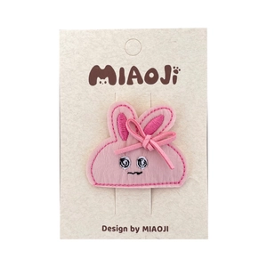 Cute pink bunny embroidery hair clip with sweet ribbon bow on beige display card
