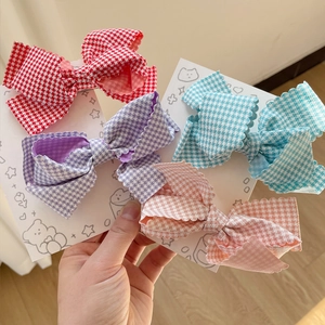 Set of four pastel plaid bow hair clips with ruffled edges in vibrant colors