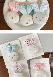 Handmade plush bunny hair clips featuring floral ears and delicate ribbon bows