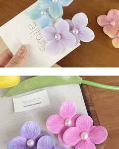 Detailed view of the gradient fabric orchid petal clip featuring a central white pearl