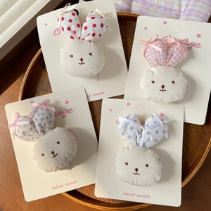 Set of 4 cute handmade bunny hair clips with floral and polka dot ribbon patterns