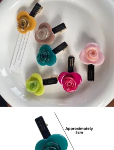 Close-up of 5cm acetate flower hair clips with France Handmade text on the back