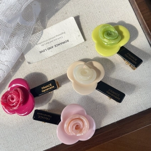Set of four acetic acid rose hair clips in cream, green, rose red, and light pink colors