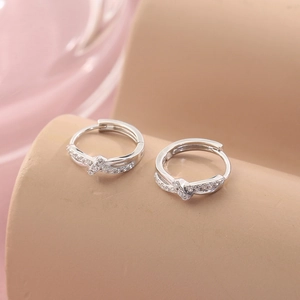 Silver twist hoop earrings with sparkling zircon stones in a minimalist Korean style