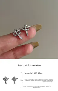 Detail view of 925 silver knot earrings with sparkling cubic zirconia and 2cm cross design