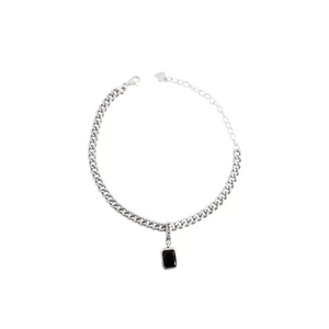 Silver Cuban link bracelet featuring a black zircon rectangular pendant and Lucky engraving