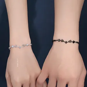 Matching couple deer antler bracelets in silver with white zircon and black gemstone