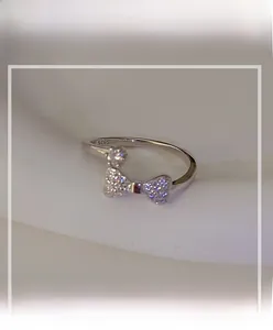 Detailed view of S925 sterling silver bow ring with sparkling crystal inlay design